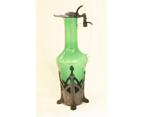 Jugendstil Art Nouveau green glass ewer with hinged pewter lid and pierced base with four paw feet, small stamped circular ma