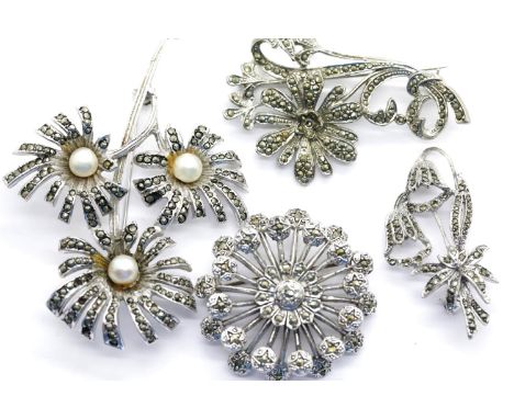 Four white metal, possibly silver, marcasite set brooches, 61g. P&amp;P Group 1 (£14+VAT for the first lot and £1+VAT for sub
