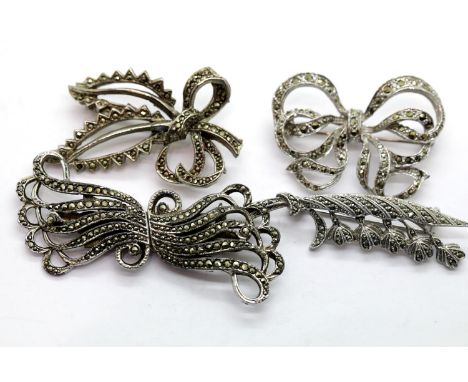 Four white metal, possibly silver, marcasite set brooches. P&amp;P Group 1 (£14+VAT for the first lot and £1+VAT for subseque