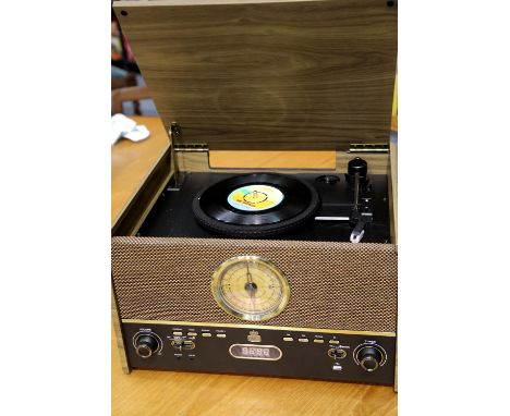 GPO Maestro Music Centre; 3 speed turntable: 33/45/78; MP3 / USB Player; Bluetooth; FM radio; wooden case & manual. This lot 