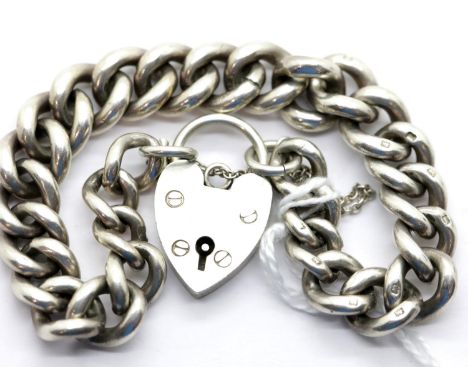 Heavy silver charm bracelet with padlock clasp and safety chain, 38g. P&amp;P Group 1 (£14+VAT for the first lot and £1+VAT f