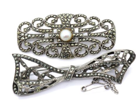 Two 925 silver marcasite set brooches, one pearl set with safety chain, widest 6 cm, 21g. P&amp;P Group 1 (£14+VAT for the fi