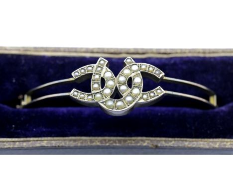 Presumed unmarked silver seed pearl triple horseshoe bangle with safety chain and presentation box, D: 6 cm. P&amp;P Group 1 