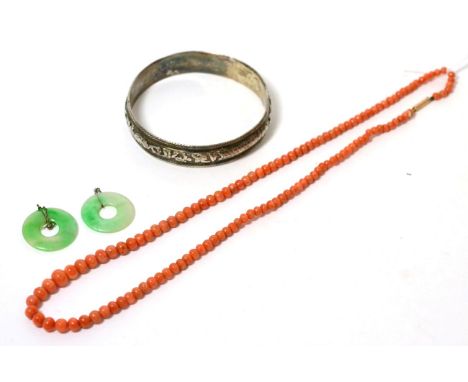 A Chinese bangle, a graduated coral bead necklace with a barrel clasp stamped '9C', length 56cm and a pair of jade bi drop ea