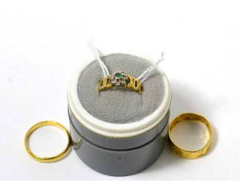 Two 22 carat band rings and an 18 carat gold dress ring (3) Two 22 carat band rings - Finger size O, N, 5.31g gross. Dress ri