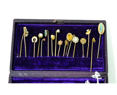 Seventeen various gold and other stick pins, including a diamond set example and a seed pearl oak leaf example