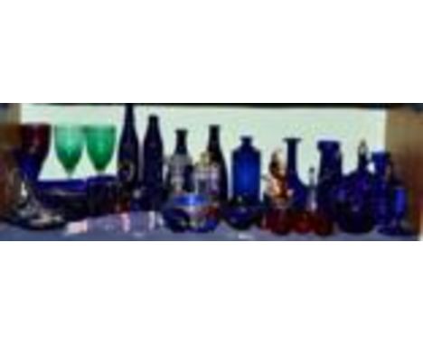 A shelf of assorted 19th century and later coloured glass