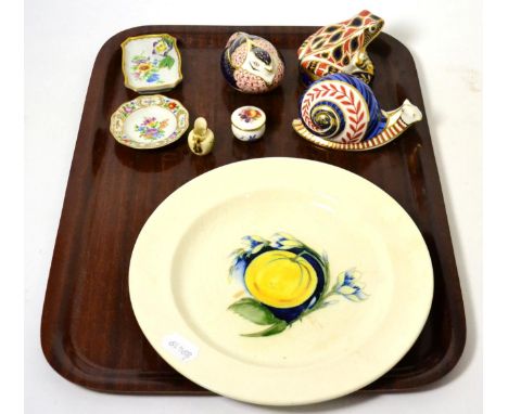 A Moorcroft pottery plate; three Royal Crown Derby china paperweights (lacking stoppers); two miniature Royal Worcester china