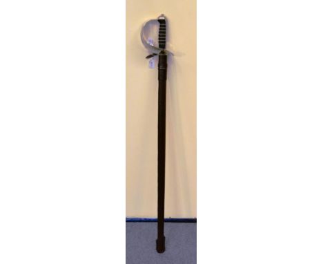 A George VI dress sword with leather bound scabbard