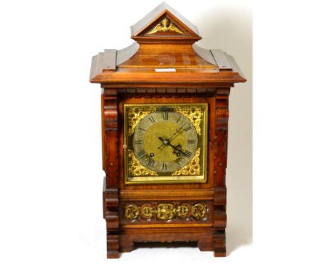 A Victorian walnut quarter striking table clock, movement back plate stamped RMS