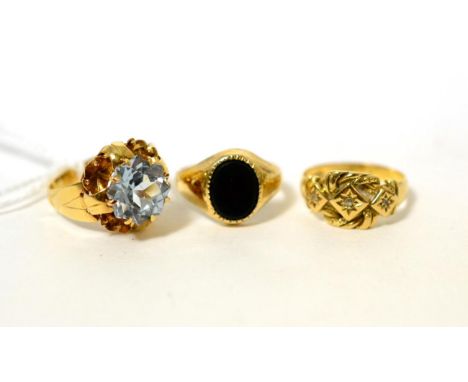 A blue topaz ring, a 9 carat gold signet ring and an 18 carat gold diamond ring (3)Blue topaz ring - Finger size K, 4.38g gro
