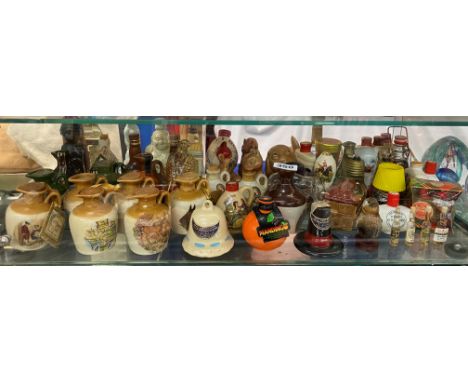 COMPLETE SHELF OF NOVELTY SPIRIT MINIATURES INCLUDING WADE WHISKEY BELLS, BESWICK NESSIE SPIRIT FLASK AND OTHERS