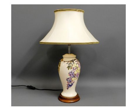 A large Moorcroft pottery lamp &amp; shade, with lamp box, 22in high inclusive 