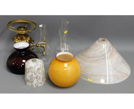A Christopher Wray brass wall lamp &amp; burgundy shade twinned with other lamp shades &amp; fittings 
