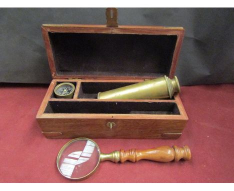 A four drawer telescope, magnifying glass and compass in hardwood domed box             
