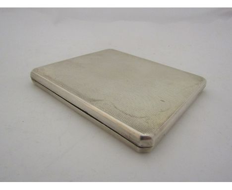 A Birmingham silver engine turned cigarette case with push slide open mechanism   