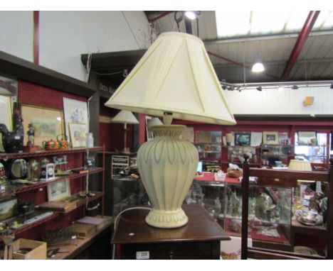 A cream painted terracotta lamp base with cream pleated shade, 66cm tall with shade
