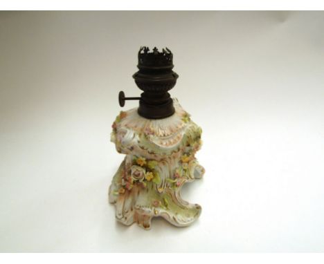 A 19th Century Continental oil lamp, base with applied floral decoration