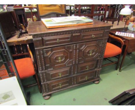 A 17th Century oak chest of four drawers with bobbin and carved panels to fronts, turned squash bun front feet, 102cm x 103cm