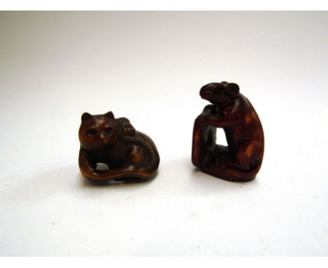 Two netsuke - one rat with money (resin) the cat with snake (wood), signed Japanese purse closures 