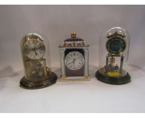 A German Kundo anniversary clock, another and a Past Times gilded clock (3)
