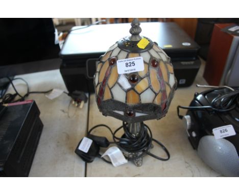 A small Tiffany style table lamp 
