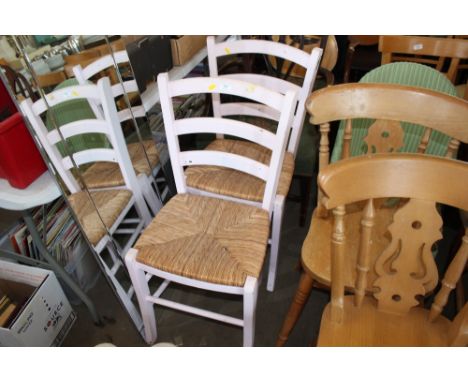 Two pink painted ladder back chairs