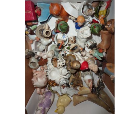 Selection of ceramic animals, bisque figurines, horn birds, two bisque cake decorations etc.