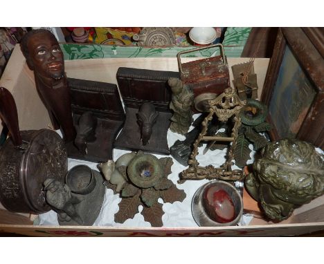Pair of wood carved book elephant bookends, soapstone figurines, ornate picture frame on stand, carved nut cracker in the for