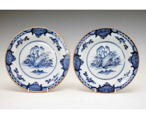 Pair of 18th Century English Delftware plates, circa 1780, each decorated in cobalt blue in the Chinese manner with a watersi