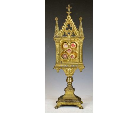 Gilt reliquary of monstrance or ostensorium, of architectural form with crocketed trefoil-pierced pediment, over glazed quatr