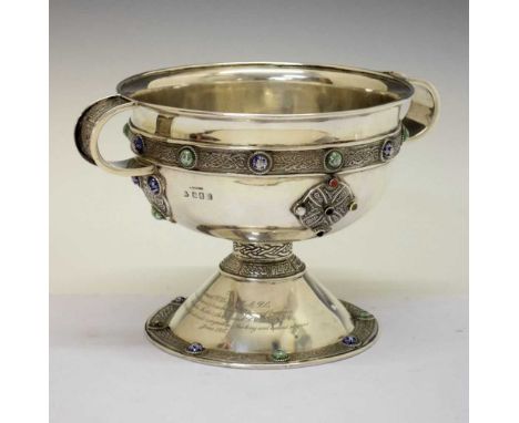 George V Irish silver pedestal bowl with two loop handles standing on a spreading foot having bands of Celtic motifs set enam