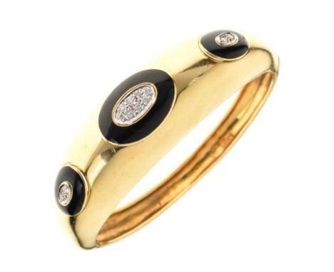 18ct gold, diamond and black enamel hinged bangle, Sheffield import marks 1974, the frontispiece with three oval black enamel
