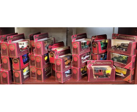 Twenty-six Matchbox Models of Yesteryear including Tate &amp; Lyle Sugar and BP Tanker in original maroon window boxes. (26)