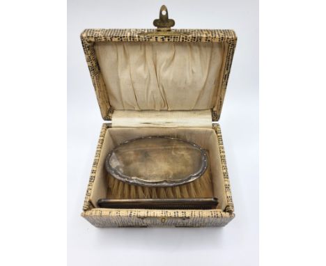 A custom boxed silver brush William Adams Ltd, Birmingham 1927 and comb stamped sterling silver. (2)