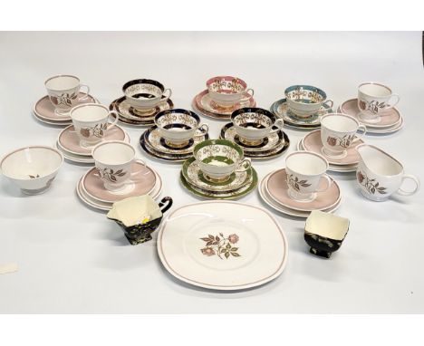 Six Royal Grafton cups and saucers with matching side plates, a Royal Winton jug and bowls with Oriental pattern on black gro