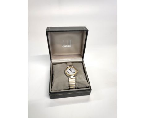 An Alfred Dunhill Date/Just Quartz wristwatch in original presentation box. Personally inscribed on the back in 1986.