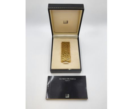 An unused boxed Dunhill Rollagas lighter.