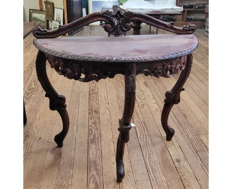 A Venetian demi lune console table