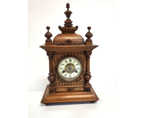 A well preserved small bracket clock c1890 with an enamel dial and in a walnut case. The maker is Hamburg American Clock Co (
