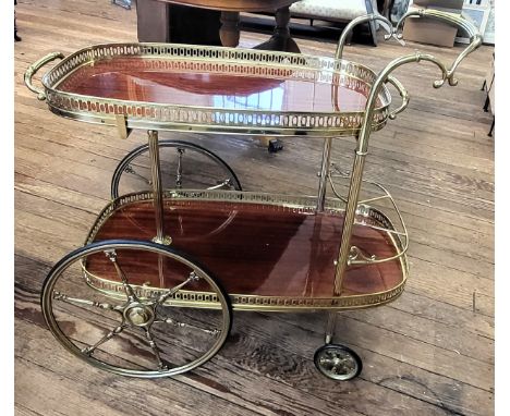 An elaborate vintage brass 'Penny Farthing' drinks trolley with removable shelf. 79cm x 81cm x 45cm.