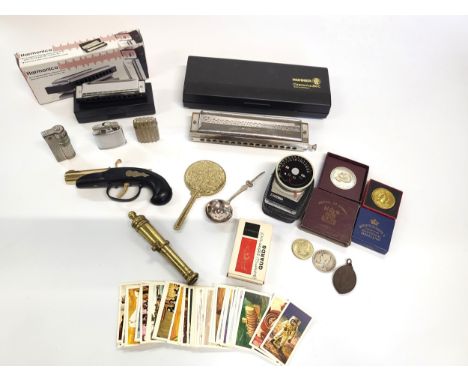 A Hohner Chromonica 280C and a Harmonica in C Major, both boxed. Also including a Queen Victoria silver half crown 1889, a Gu