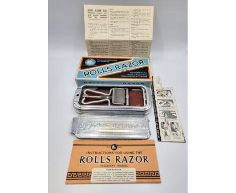 A Rolls razor in original box with instructions