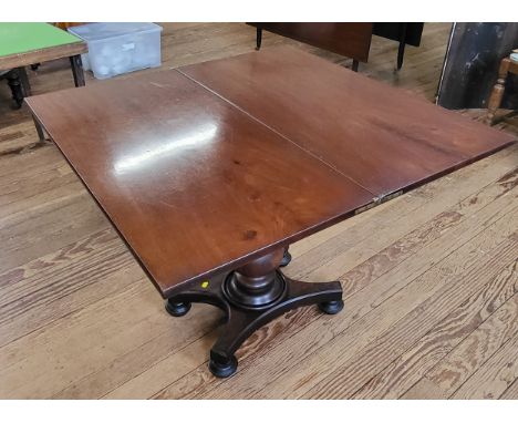 A mahogany card table with swivel top to reveal compartment beneath. 70cm x 91cm x 91cm.