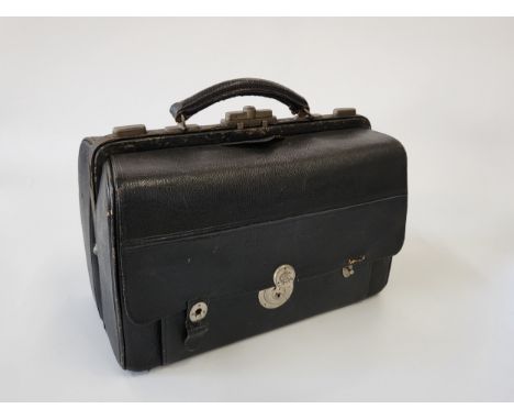 A monogramed (C&amp;A) leather travelling case including a lift out compartment (inscribed 'to Mrs Chapman in grateful recogn