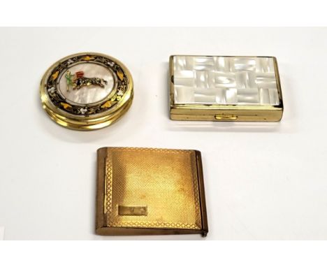 A musical compact with mother of pearl top, a compact by Pygmalion, and a compact with a matador and bull fighting. (3)