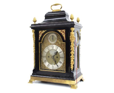 English ebonised double fusee verge bracket clock, the 7" brass arched dial signed John Taylor, London on a silver shaped rec