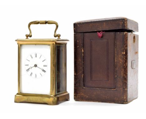 French carriage clock striking on a bell, within a corniche brass case, 7" high, with Morocco leather travelling case