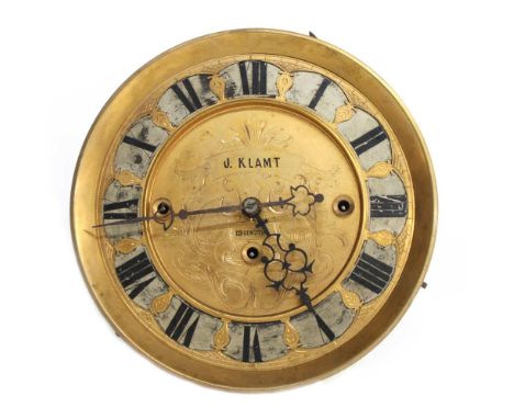 Vienna regulator triple weight wall clock movement, the 6.5" gilt and silvered chapter ring enclosing a recessed foliate engr