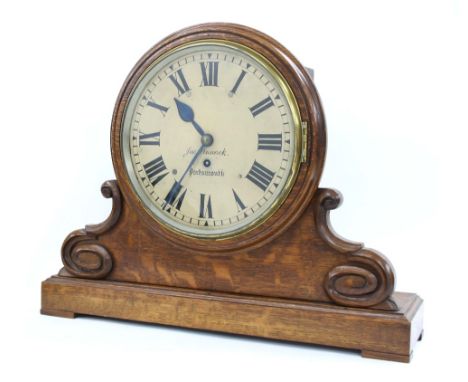 Oak single fusee bank clock and bracket, the 10" circular dial signed Jas Pinnock, Portsmouth, within a turned surround upon 